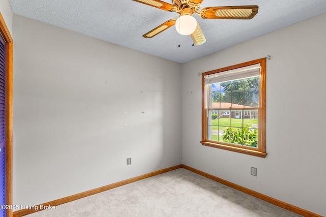 7502 Sam Ct, Louisville, KY 40214 - spare room with light colored carpet, a textured ceiling, and ceiling fan