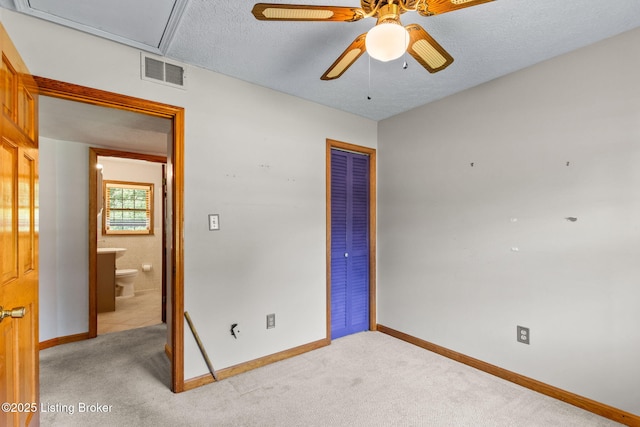 7502 Sam Ct, Louisville, KY 40214 - unfurnished bedroom with attic access, a closet, light colored carpet, a textured ceiling, and ceiling fan
