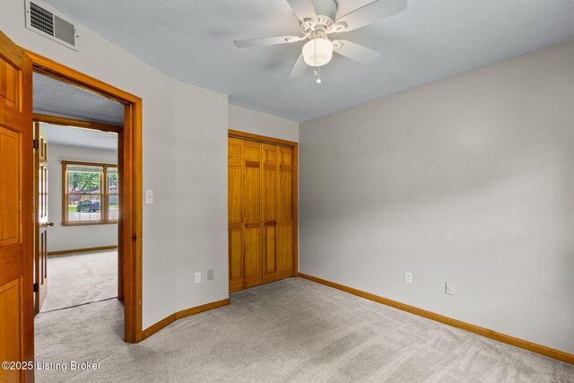 7502 Sam Ct, Louisville, KY 40214 - unfurnished bedroom with light carpet, a closet, and ceiling fan