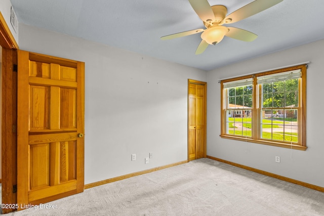 7502 Sam Ct, Louisville, KY 40214 - spare room featuring light carpet and a ceiling fan