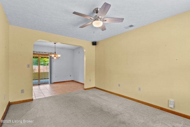 7502 Sam Ct, Louisville, KY 40214 - spare room with arched walkways, a chandelier, a ceiling fan, carpet floors, and a textured ceiling