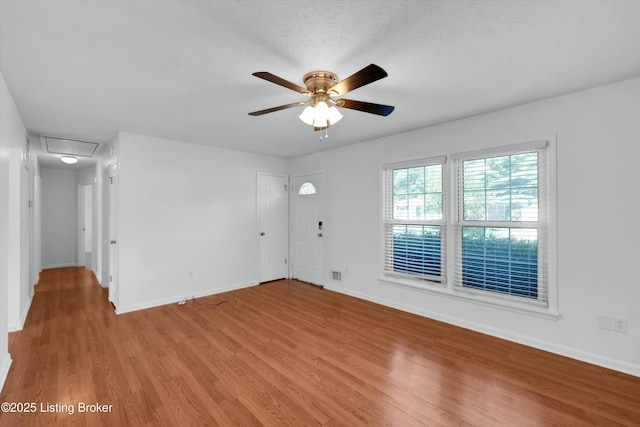 8313 Daverman Dr, Louisville, KY 40228 - unfurnished living room featuring ceiling fan, light wood-type flooring, and attic access