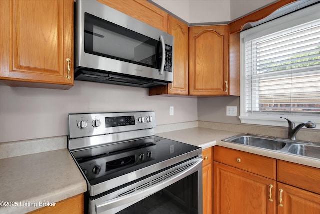 8313 Daverman Dr, Louisville, KY 40228 - kitchen featuring stainless steel appliances, light countertops, and brown cabinets