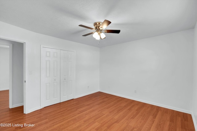 8313 Daverman Dr, Louisville, KY 40228 - unfurnished bedroom with light wood finished floors, a closet, and ceiling fan