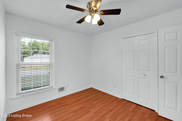 8313 Daverman Dr, Louisville, KY 40228 - unfurnished bedroom featuring light wood finished floors and a ceiling fan