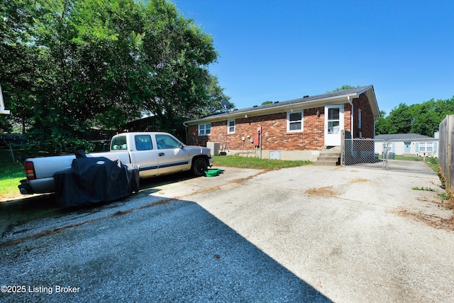 8313 Daverman Dr, Louisville, KY 40228 - rear view of property featuring brick siding