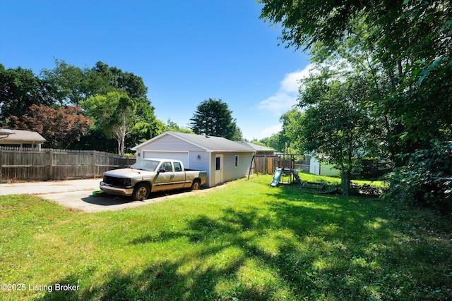 8313 Daverman Dr, Louisville, KY 40228 - fenced yard featuring a playground, a garage, and an outbuilding