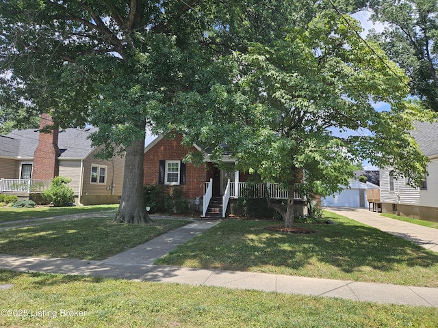 3919 Staebler Ave, Louisville, KY 40207 - obstructed view of property featuring a front lawn, covered porch, and brick siding
