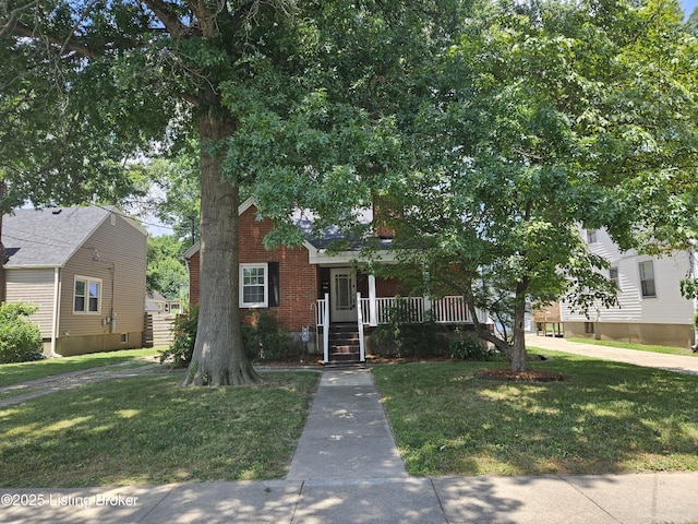 3919 Staebler Ave, Louisville, KY 40207 - obstructed view of property with a front yard and a porch