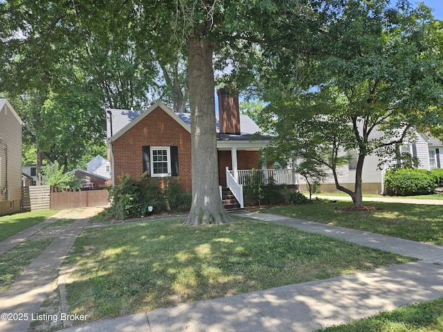 3919 Staebler Ave, Louisville, KY 40207 - view of front of house with a chimney, brick siding, and covered porch