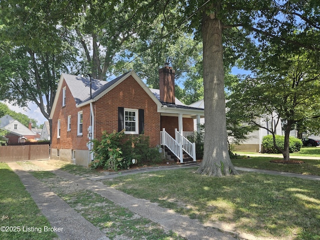 3919 Staebler Ave, Louisville, KY 40207 - view of front facade featuring a chimney and brick siding