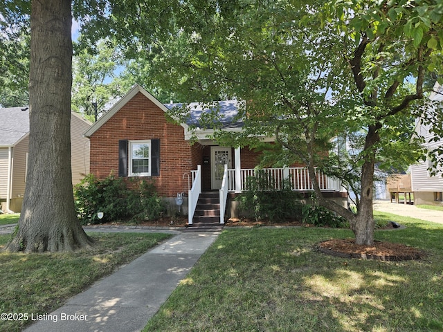 3919 Staebler Ave, Louisville, KY 40207 - view of front of house featuring brick siding, a front lawn, and a porch