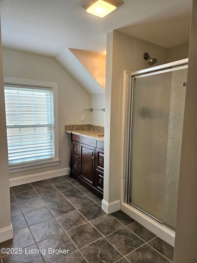 3919 Staebler Ave, Louisville, KY 40207 - bathroom featuring vanity, a shower stall, and vaulted ceiling