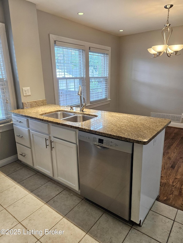 3919 Staebler Ave, Louisville, KY 40207 - kitchen with stainless steel dishwasher, a chandelier, light stone countertops, plenty of natural light, and recessed lighting