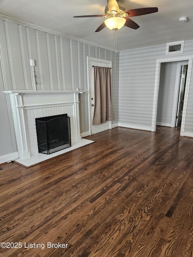 3919 Staebler Ave, Louisville, KY 40207 - unfurnished living room with a fireplace, a ceiling fan, crown molding, and dark wood-type flooring