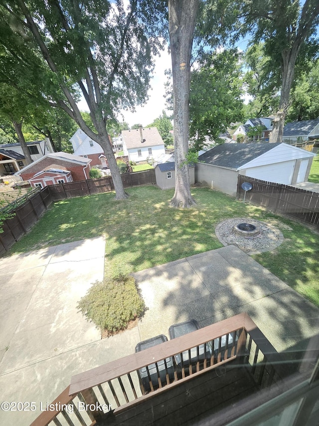 3919 Staebler Ave, Louisville, KY 40207 - fenced backyard featuring a shed, a patio, and a fire pit
