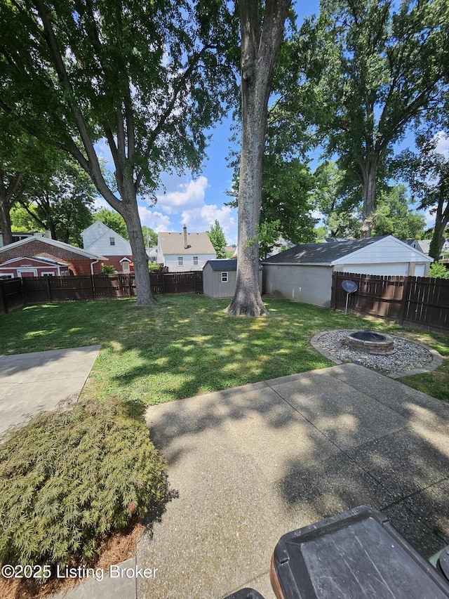 3919 Staebler Ave, Louisville, KY 40207 - fenced backyard featuring a fire pit and a patio