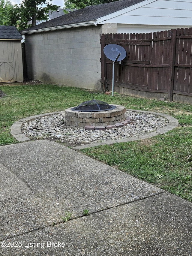 3919 Staebler Ave, Louisville, KY 40207 - view of yard with a storage unit and an outdoor fire pit