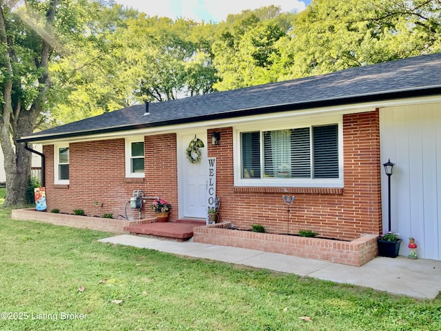 444 Lagrange Rd, New Castle, KY 40050 - view of front of house with brick siding, a front yard, and a shingled roof