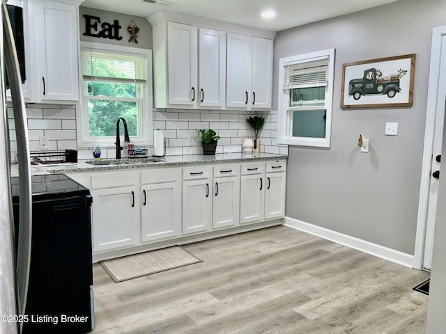 444 Lagrange Rd, New Castle, KY 40050 - kitchen with stove, backsplash, white cabinetry, light stone counters, and recessed lighting