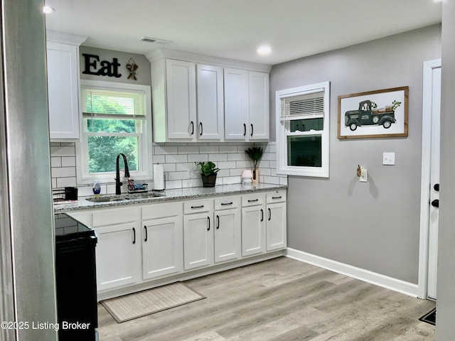 444 Lagrange Rd, New Castle, KY 40050 - kitchen featuring backsplash, white cabinetry, light stone countertops, light wood-type flooring, and recessed lighting