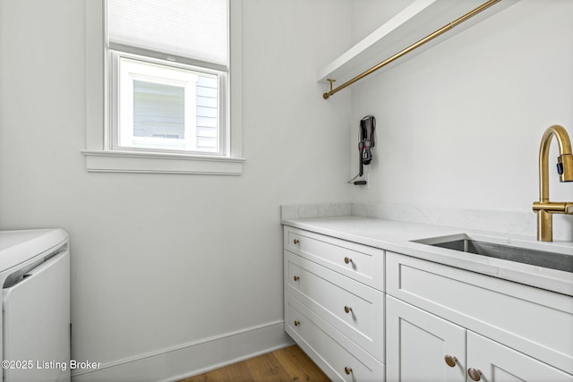 6115 Passionflower Dr, Prospect, KY 40059 - washroom with washing machine and clothes dryer, cabinet space, and dark wood finished floors