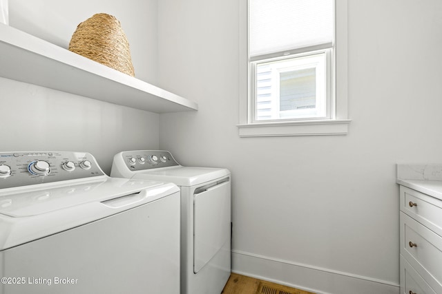 6115 Passionflower Dr, Prospect, KY 40059 - laundry area with separate washer and dryer and wood finished floors