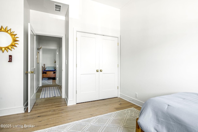 6115 Passionflower Dr, Prospect, KY 40059 - bedroom with wood finished floors and a closet
