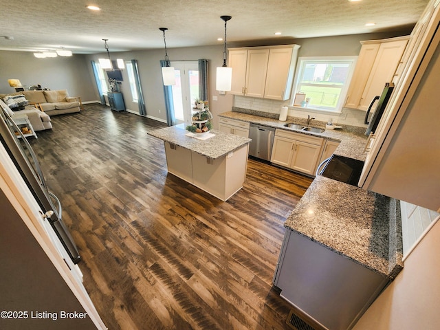 12630 Orell Station Pl, Louisville, KY 40272 - kitchen with stainless steel dishwasher, open floor plan, a kitchen island, recessed lighting, and dark wood finished floors