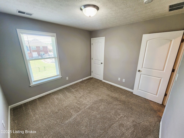 12630 Orell Station Pl, Louisville, KY 40272 - unfurnished bedroom featuring carpet flooring and a textured ceiling
