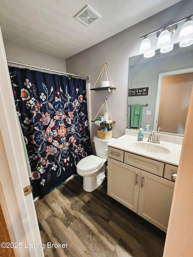 12630 Orell Station Pl, Louisville, KY 40272 - full bathroom with wood finished floors, vanity, a textured ceiling, and a shower with shower curtain