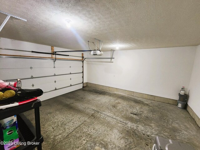 12630 Orell Station Pl, Louisville, KY 40272 - garage featuring a garage door opener and baseboards