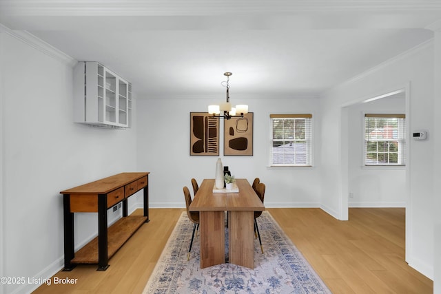 3407 Hillsboro Rd, Louisville, KY 40207 - dining area with a chandelier, light wood finished floors, and crown molding