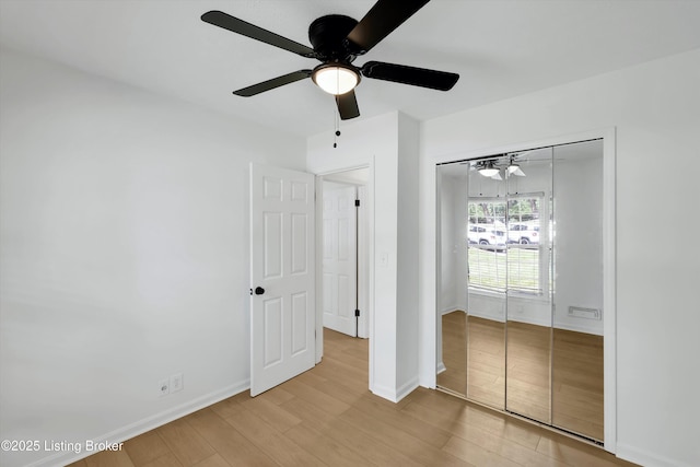 3407 Hillsboro Rd, Louisville, KY 40207 - unfurnished bedroom with light wood finished floors, a closet, and a ceiling fan