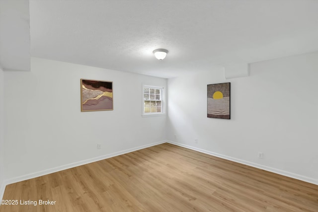 3407 Hillsboro Rd, Louisville, KY 40207 - unfurnished room with light wood-style flooring and a textured ceiling