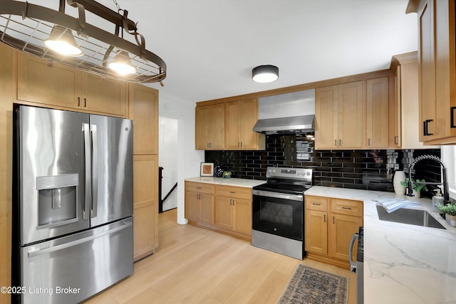 3407 Hillsboro Rd, Louisville, KY 40207 - kitchen featuring stainless steel appliances, backsplash, light wood-style floors, and light stone countertops