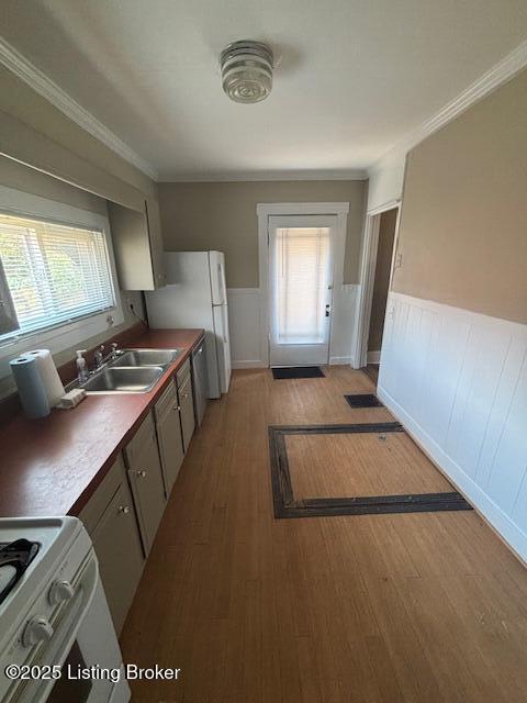 1842 Deer Park Ave, Louisville, KY 40205 - kitchen featuring white appliances, wainscoting, light wood-style flooring, and crown molding