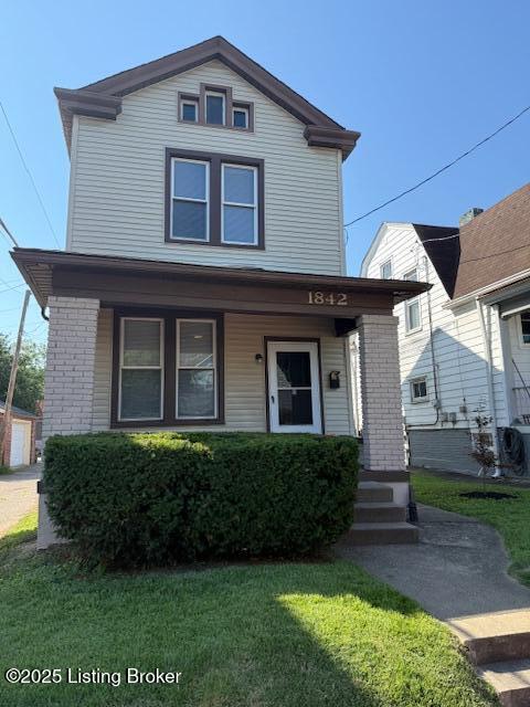 1842 Deer Park Ave, Louisville, KY 40205 - view of front of property featuring a porch, a front lawn, and brick siding