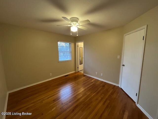 3510 Ethelwood Dr, Jeffersontown, KY 40299 - unfurnished bedroom featuring dark wood-type flooring and a ceiling fan