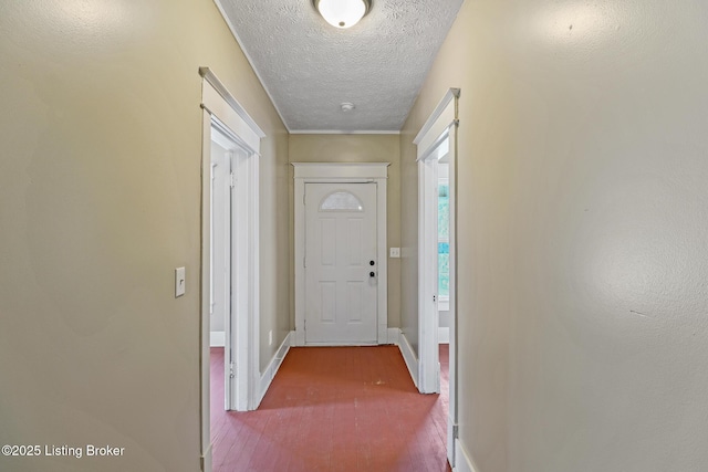 2522 Wilson Ave, Louisville, KY 40210 - doorway with a textured ceiling and baseboards