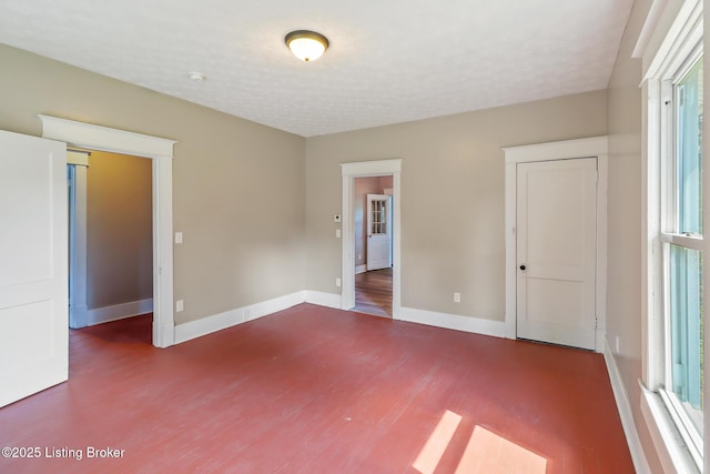 2522 Wilson Ave, Louisville, KY 40210 - unfurnished bedroom featuring wood finished floors and baseboards