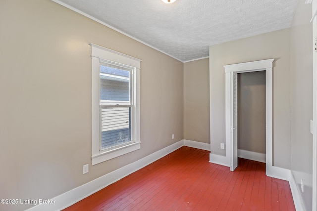 2522 Wilson Ave, Louisville, KY 40210 - unfurnished bedroom featuring wood-type flooring, a textured ceiling, and ornamental molding