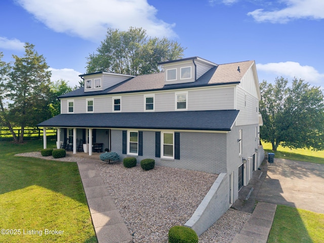 10020 Oak Grove Rd, Louisville, KY 40291 - view of front facade with covered porch, a shingled roof, brick siding, and driveway