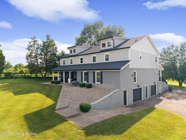 10020 Oak Grove Rd, Louisville, KY 40291 - view of front of house with a garage, board and batten siding, and driveway