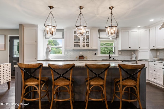 10020 Oak Grove Rd, Louisville, KY 40291 - kitchen with a kitchen island, backsplash, light stone countertops, plenty of natural light, and recessed lighting