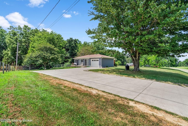 2625 Shumate Rd, Ekron, KY 40117 - ranch-style house featuring a garage, driveway, and view of scattered trees