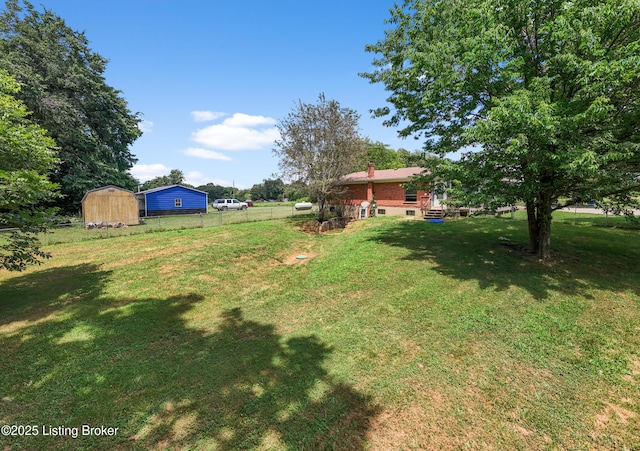 2625 Shumate Rd, Ekron, KY 40117 - view of yard featuring a storage unit