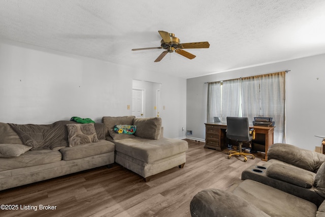2625 Shumate Rd, Ekron, KY 40117 - living area featuring an office area, wood finished floors, a ceiling fan, and a textured ceiling