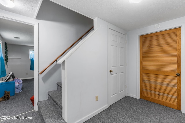2625 Shumate Rd, Ekron, KY 40117 - stairway with a textured ceiling and carpet flooring