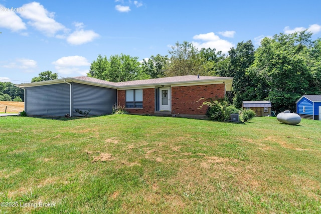 2625 Shumate Rd, Ekron, KY 40117 - single story home with a front lawn, brick siding, and a storage shed